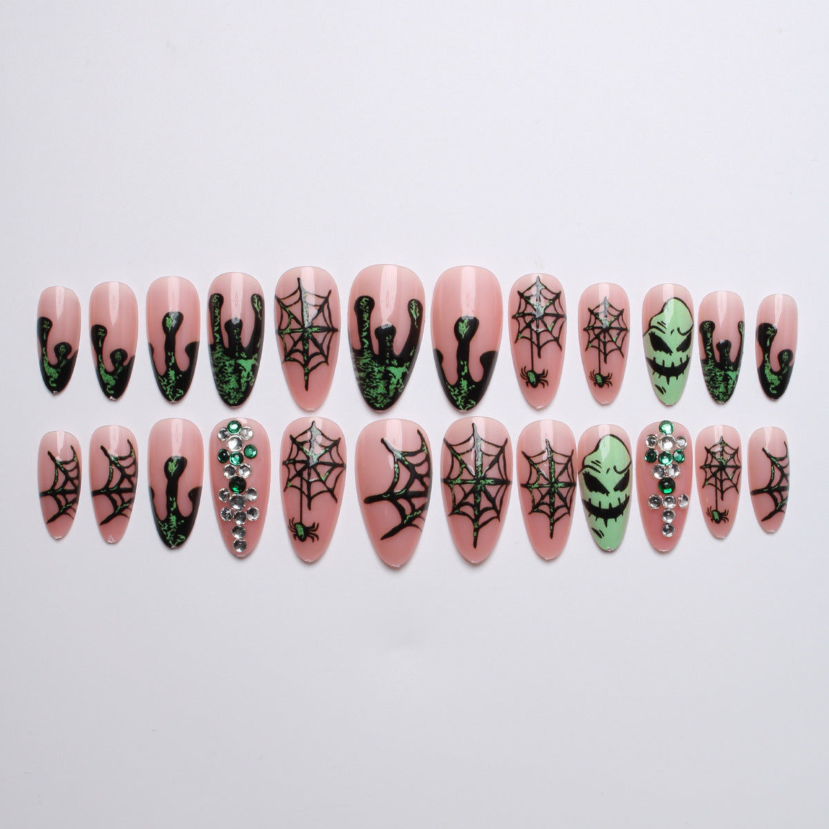 Acrylic nails with Halloween spider design and glitter accents Stornfield