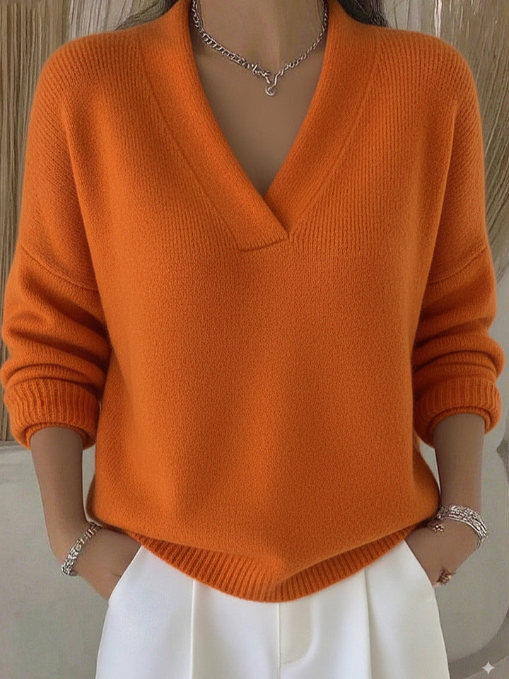 Relaxed Knit Sweater with Deep V-Neckline and Ribbed Hem